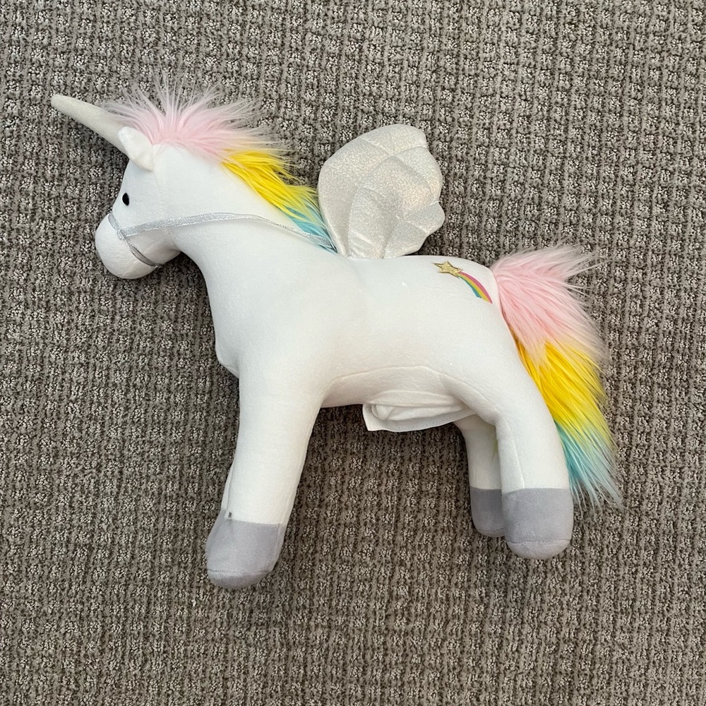 Unicorn that makes noises & lights up.